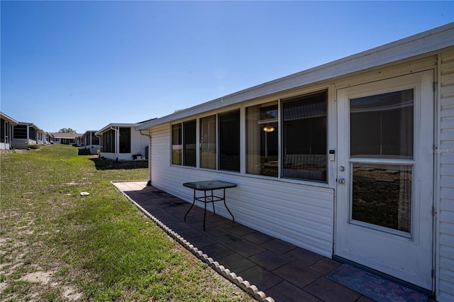 view of yard featuring a sunroom