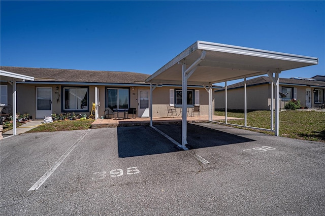 view of partially covered parking lot