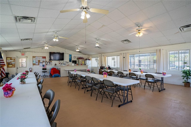 dining area with visible vents, a paneled ceiling, and lofted ceiling