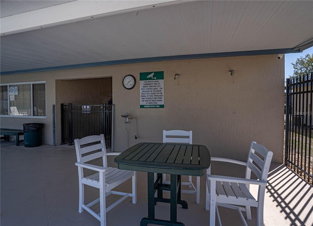 view of patio / terrace featuring outdoor dining space and fence