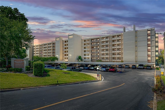 view of building exterior featuring covered parking