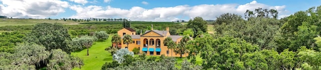 birds eye view of property with a rural view