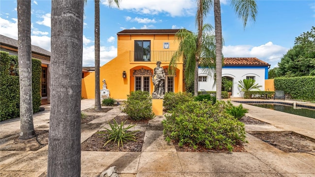 mediterranean / spanish home with stucco siding