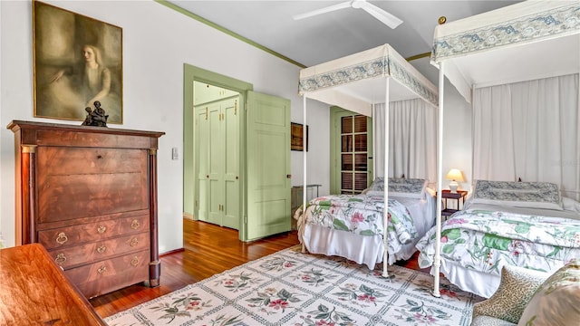 bedroom featuring ceiling fan and dark wood finished floors