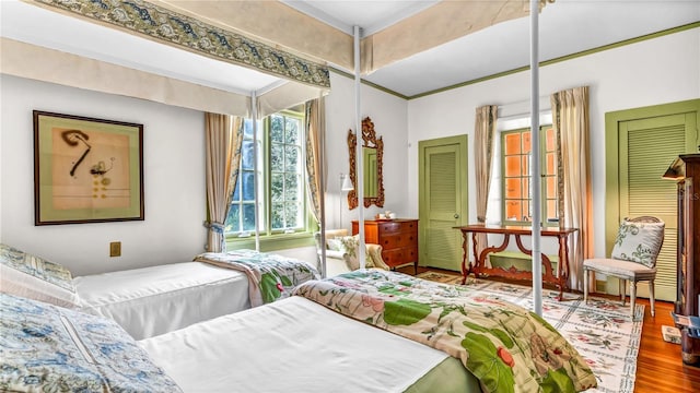 bedroom featuring wood finished floors