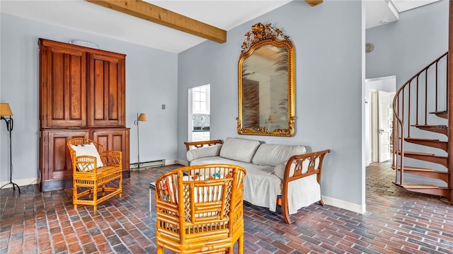 living area featuring brick floor, stairway, baseboards, and baseboard heating