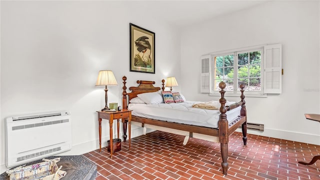 bedroom featuring brick floor, heating unit, baseboards, and a baseboard radiator