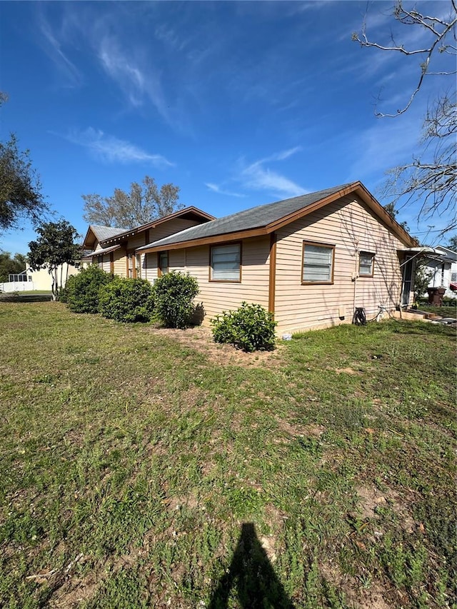 view of property exterior featuring a yard