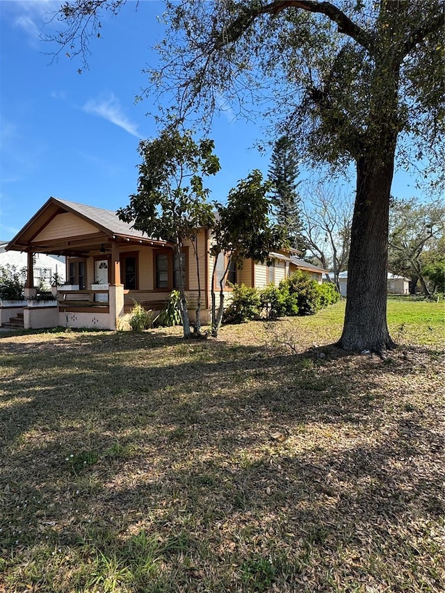 view of front of home with a front lawn and covered porch