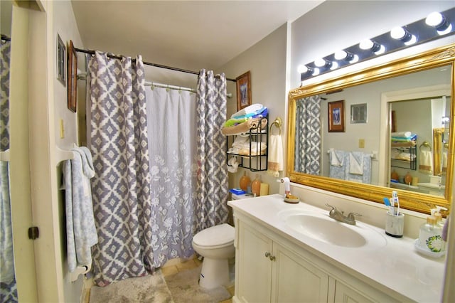 bathroom featuring a shower with curtain, toilet, and vanity