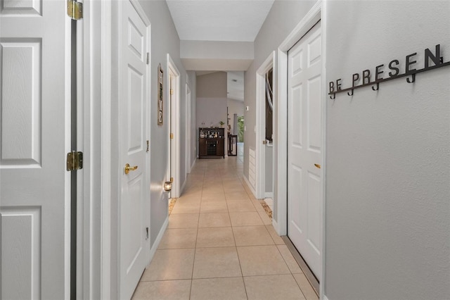 hallway with light tile patterned floors