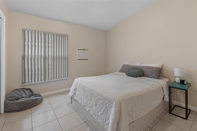 tiled bedroom with baseboards