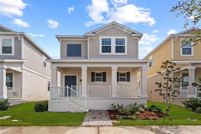 view of front of property featuring a porch and a front yard