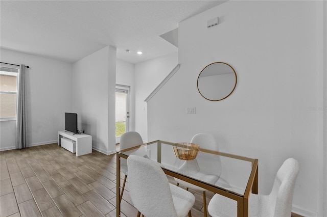 dining area featuring recessed lighting, baseboards, plenty of natural light, and light wood-style floors