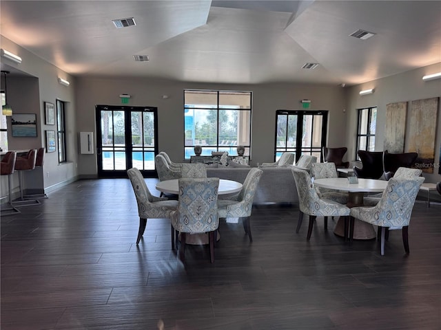 dining space with visible vents and french doors