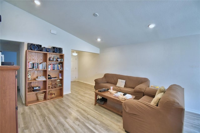 living area featuring recessed lighting, wood finished floors, baseboards, and high vaulted ceiling