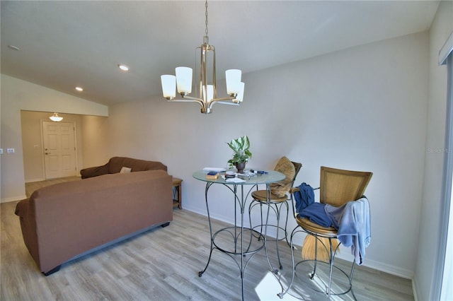 living room featuring light wood-type flooring, recessed lighting, baseboards, lofted ceiling, and a chandelier