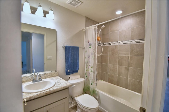 bathroom featuring vanity, toilet, visible vents, and shower / tub combo with curtain