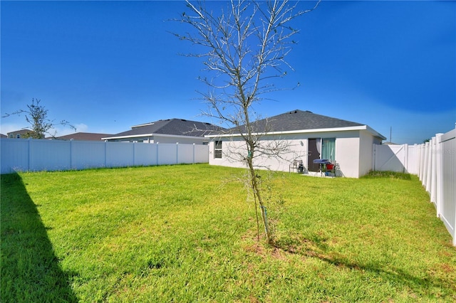 view of yard with a fenced backyard