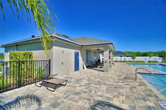 exterior space featuring a patio area, ceiling fan, and fence