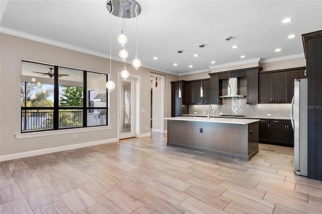 kitchen with black cooktop, freestanding refrigerator, light countertops, wall chimney exhaust hood, and tasteful backsplash