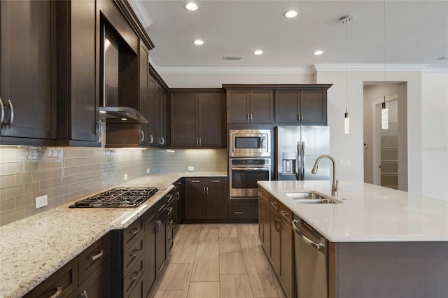 kitchen with visible vents, a sink, stainless steel appliances, dark brown cabinets, and wall chimney range hood