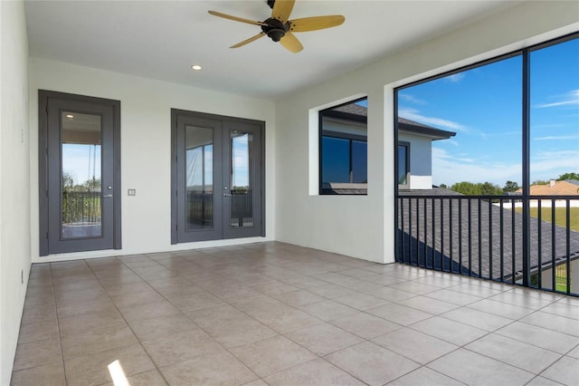 tiled spare room featuring recessed lighting, french doors, and a ceiling fan