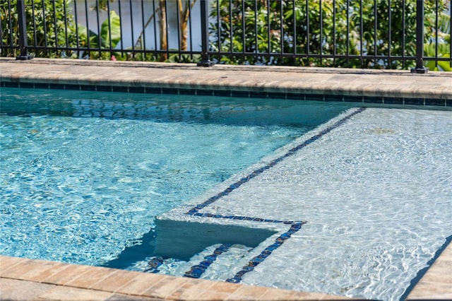 view of pool featuring a pool with connected hot tub