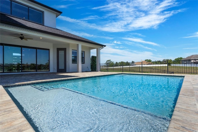 view of pool featuring a patio area, a fenced in pool, ceiling fan, and fence