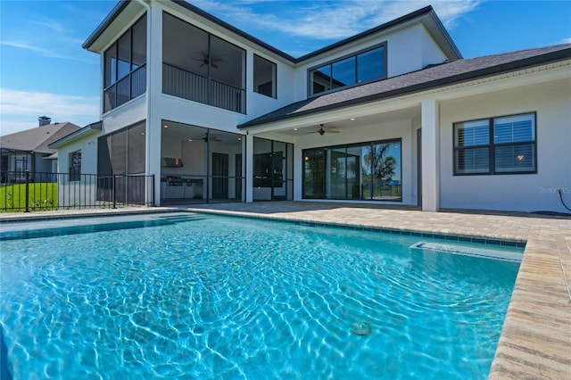 view of pool with a patio, fence, a fenced in pool, and ceiling fan