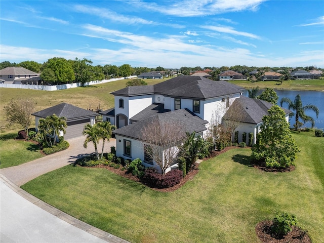 birds eye view of property featuring a residential view and a water view