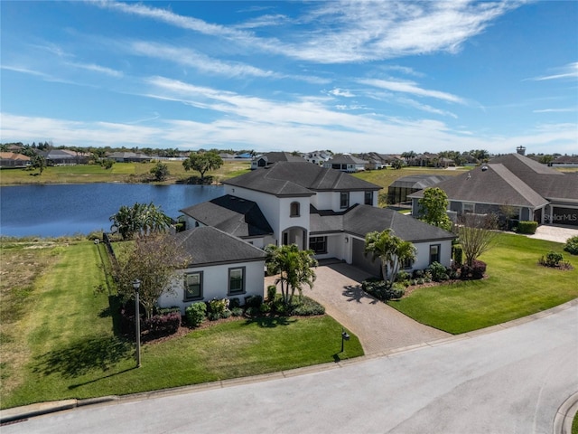 aerial view featuring a residential view and a water view