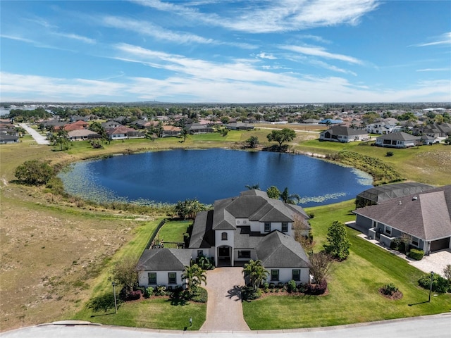 aerial view with a water view and a residential view