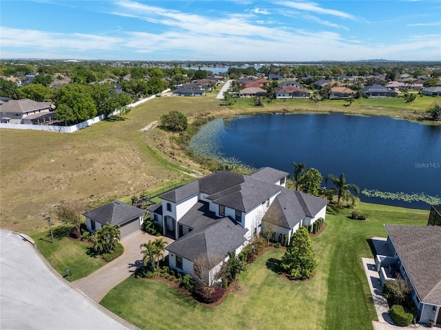 birds eye view of property featuring a residential view and a water view