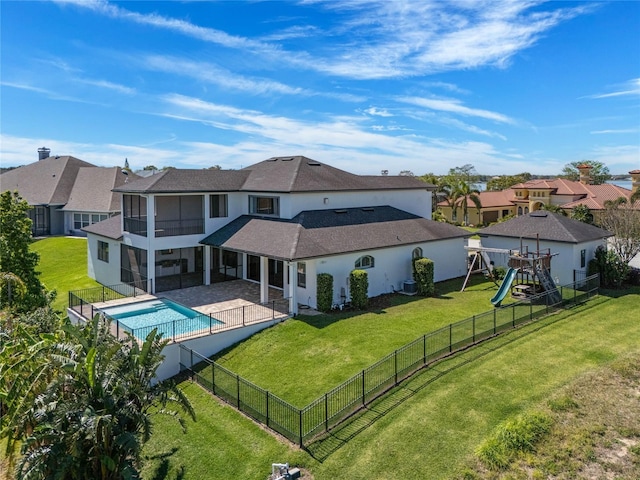 back of property featuring a patio area, a residential view, stucco siding, and a yard