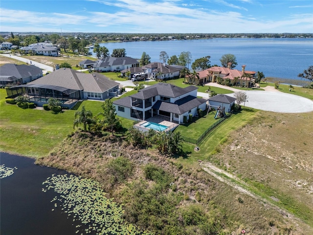 birds eye view of property featuring a residential view and a water view