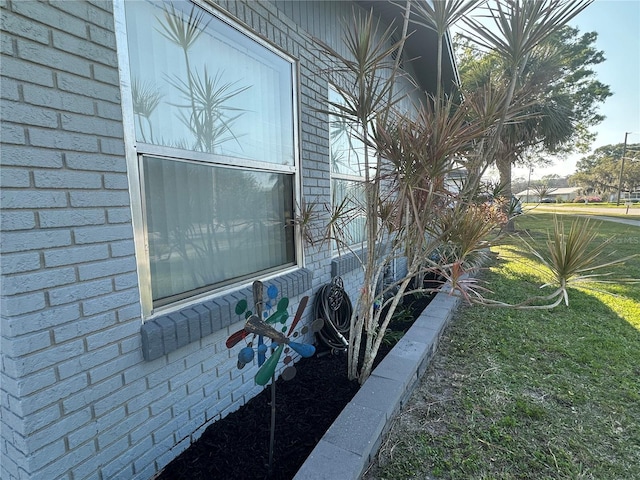 exterior space featuring brick siding