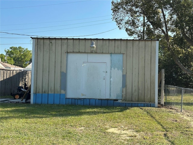 view of shed featuring fence