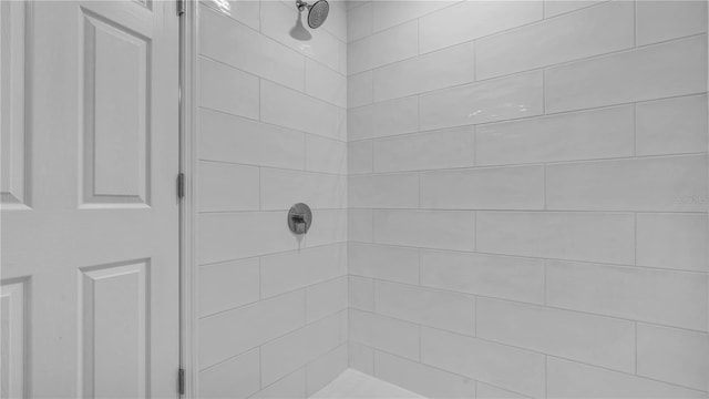 full bathroom with tiled shower