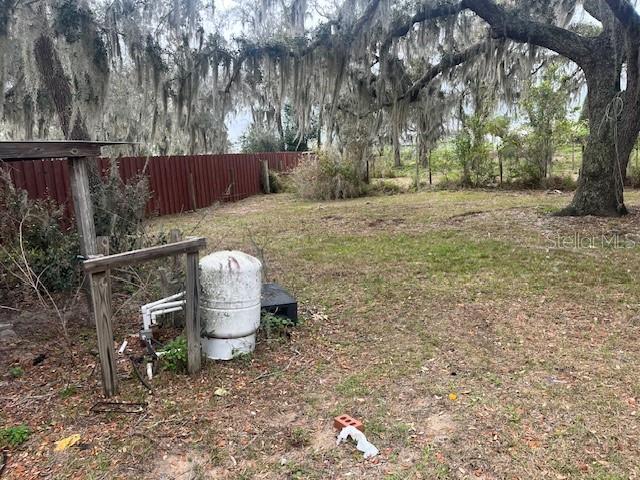 view of yard with fence