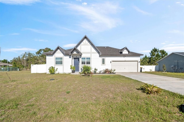 747 Fraser Ct, Kissimmee, FL 34759 - modern farmhouse featuring a garage, driveway, fence, a front yard, and stucco siding