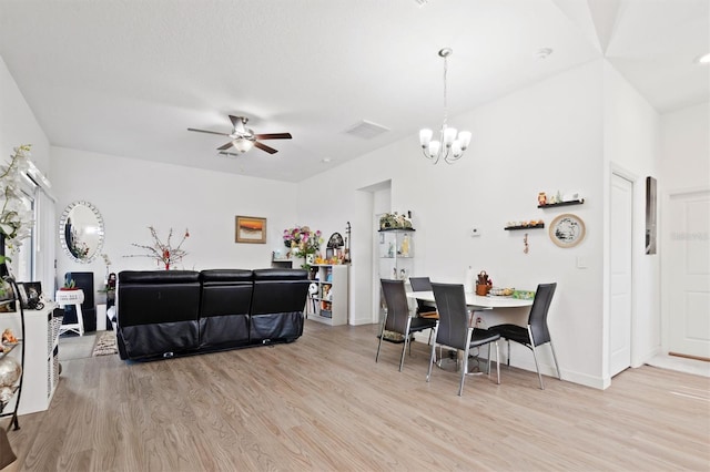 747 Fraser Ct, Kissimmee, FL 34759 - dining space with ceiling fan with notable chandelier, baseboards, visible vents, and light wood-style floors