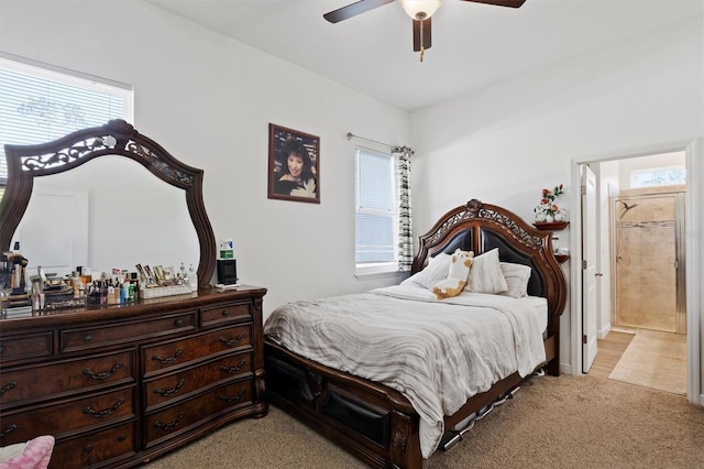 747 Fraser Ct, Kissimmee, FL 34759 - bedroom featuring a ceiling fan, ensuite bath, and light colored carpet
