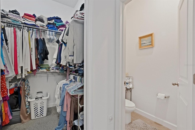 747 Fraser Ct, Kissimmee, FL 34759 - walk in closet featuring wood finished floors