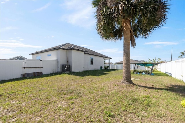 747 Fraser Ct, Kissimmee, FL 34759 - view of yard featuring a fenced backyard and cooling unit