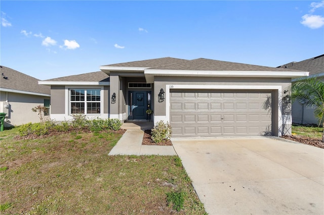 view of front of home featuring stucco siding, an attached garage, a shingled roof, and driveway