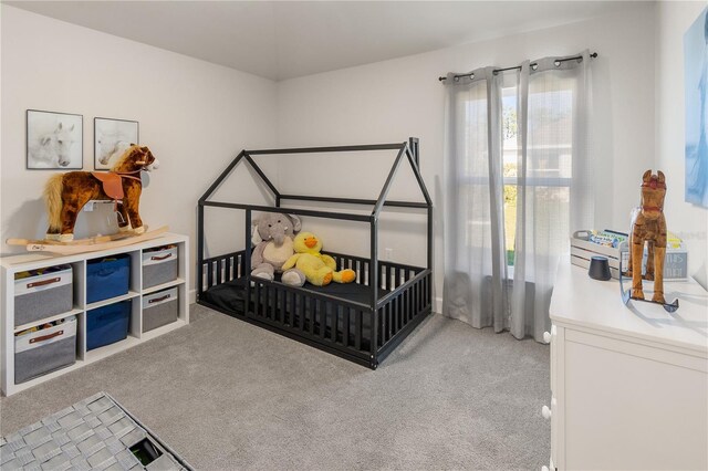 bedroom featuring light colored carpet