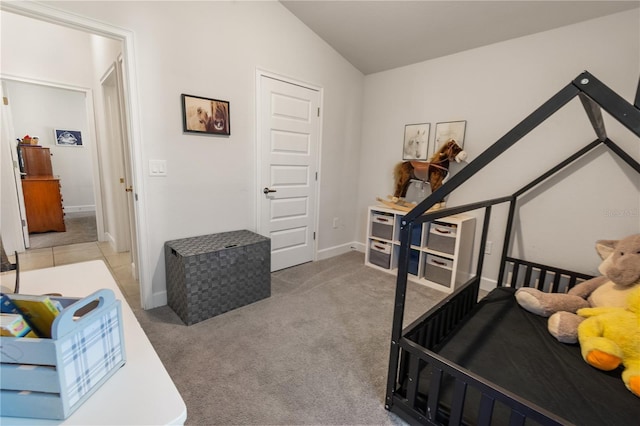 bedroom featuring vaulted ceiling, carpet flooring, and baseboards