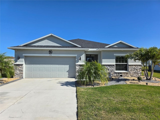 single story home with concrete driveway, an attached garage, stone siding, and stucco siding