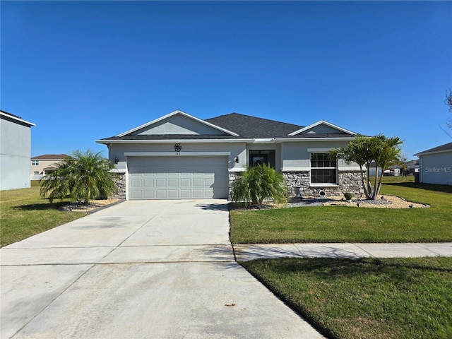 view of front of home with a front yard, a garage, stone siding, and concrete driveway